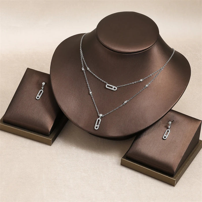 RAKOL Ensemble de bijoux géométriques double couche avec collier, boucles d'oreilles, bague et bracelet pour femme – Cadeaux élégants pour les occasions festives