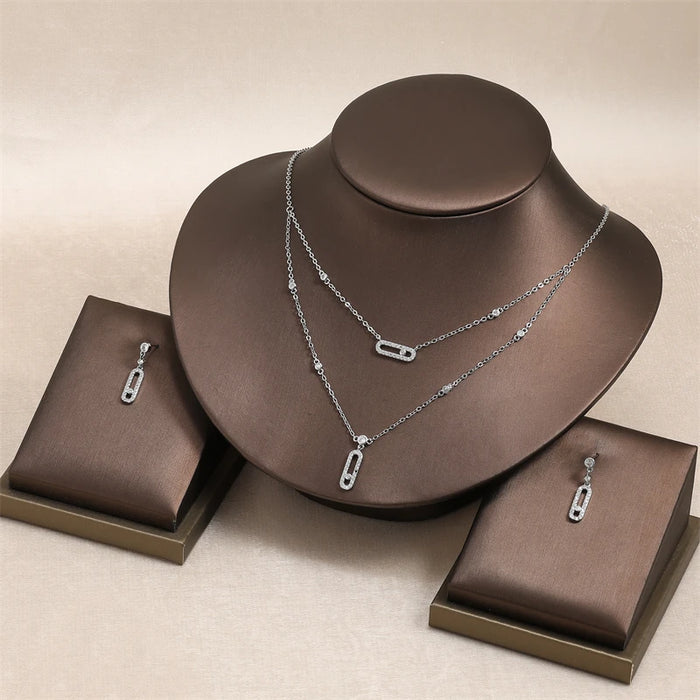 RAKOL Ensemble de bijoux géométriques double couche avec collier, boucles d'oreilles, bague et bracelet pour femme – Cadeaux élégants pour les occasions festives